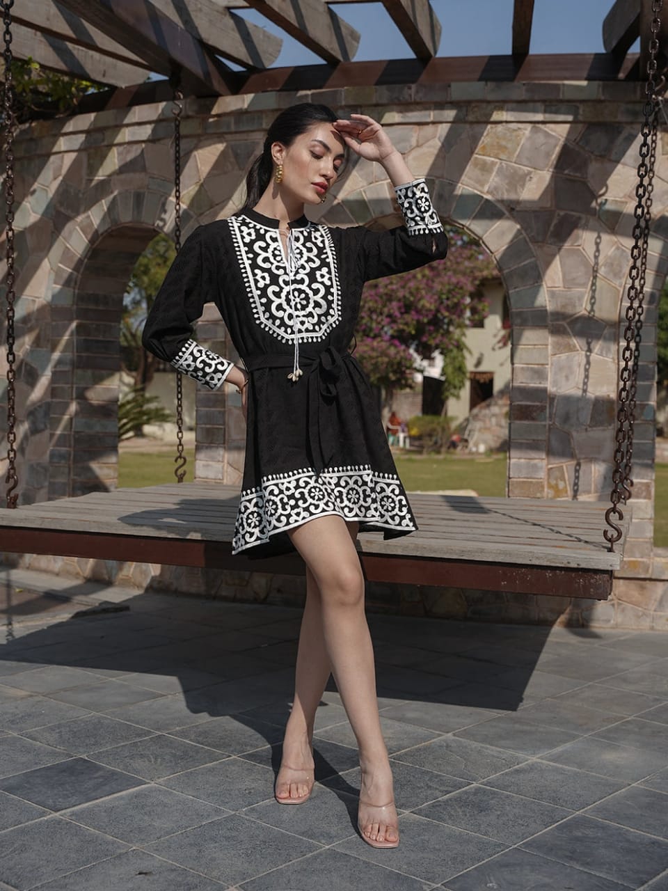 Elegant Black Dress with Apron Design Neckline and Hem Border